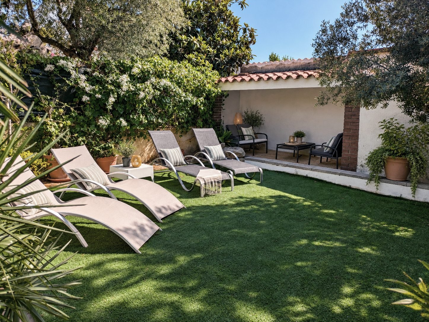 Garden loungers and shaded seating at The Pines
